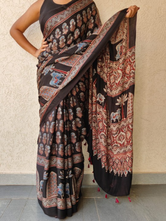 Ajrakh print sarees — a timeless blend of tradition and craftsmanship, featuring intricate handblock patterns in rich natural dyes for an elegant, earthy charm.