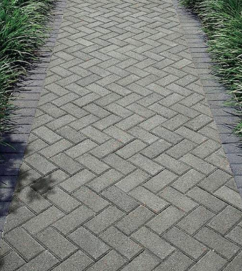 cement-based construction materials, primarily concrete blocks, pavers, and bricks