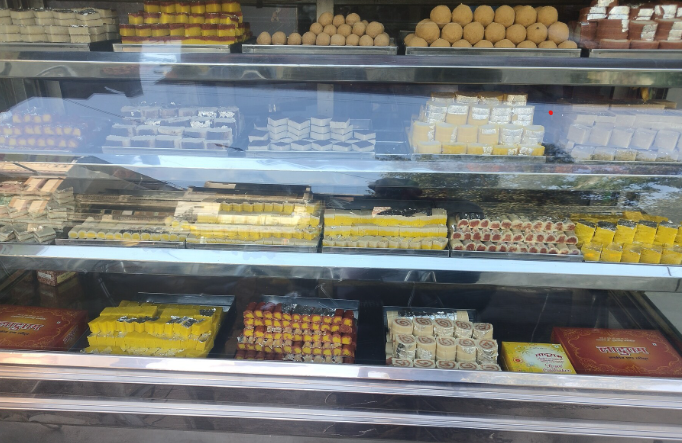 Sweet shop offering a tempting variety of Indian namkeen and delicious sweets snacks.